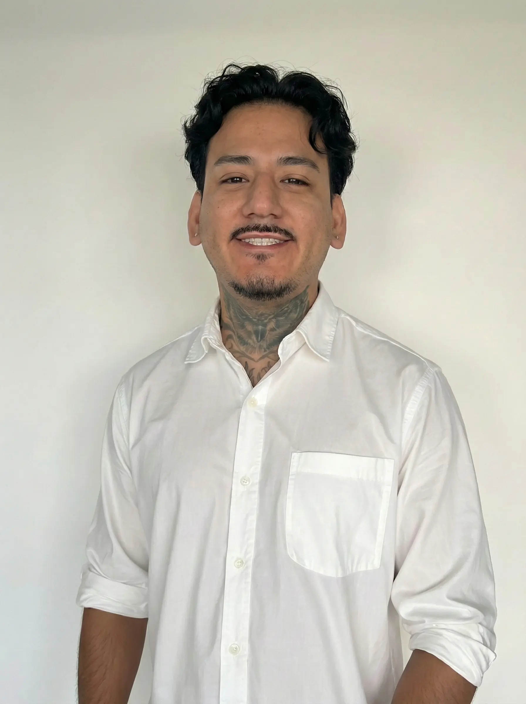 Team reviewing branding concepts on large monitor