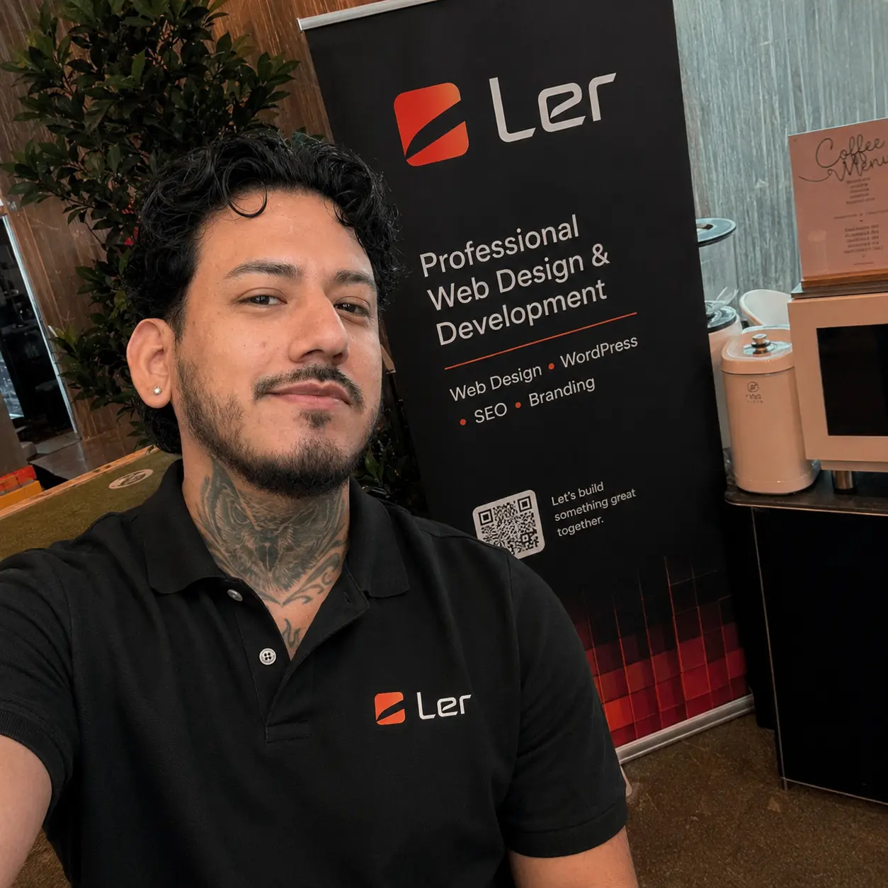 Ed Romero in front of the LER Web Services commercial display