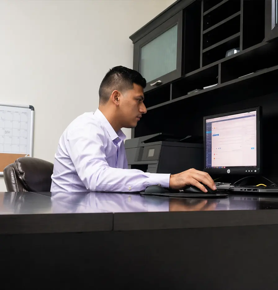 Edson working at a desk
