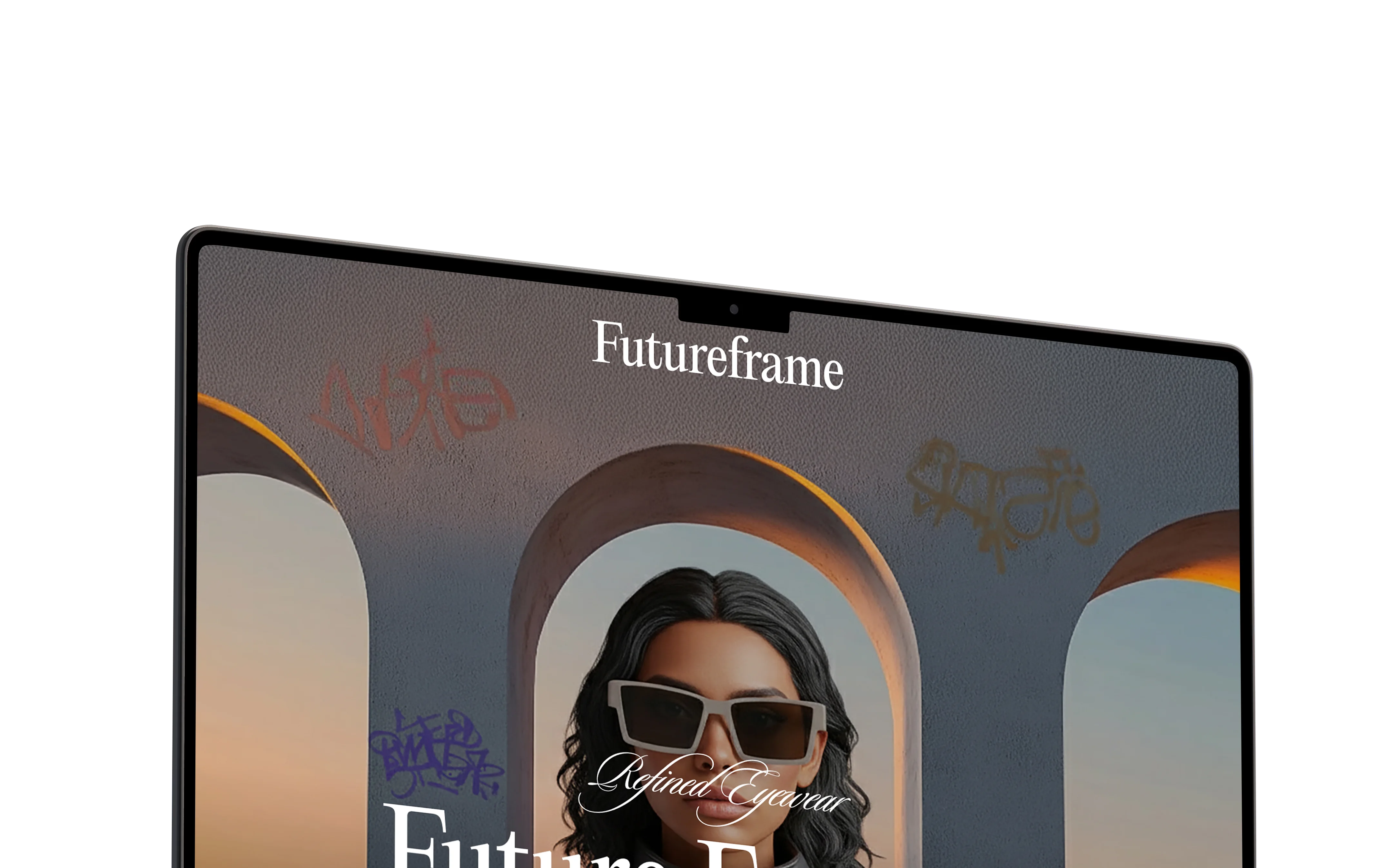 Angled laptop showing the Futureframe refined eyewear website with editorial fashion imagery