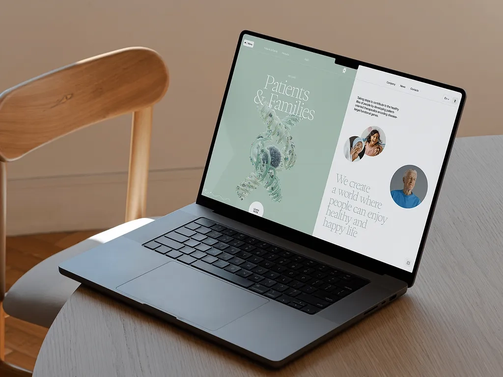 Laptop on chair showing Helixwell website