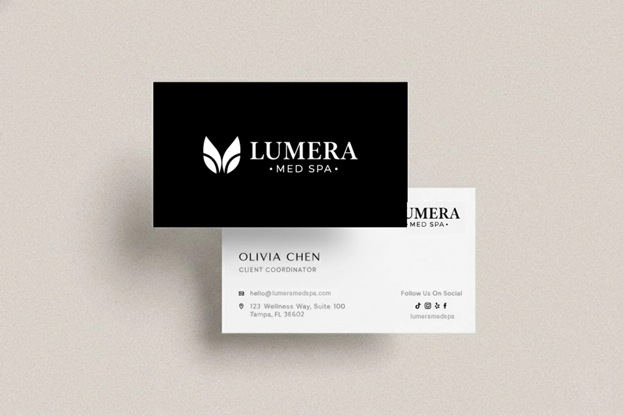 Lumera business cards featuring brand identity and staff contact details